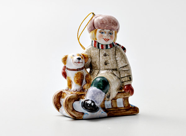 Christmas tree toy Boy on a sled with a dog