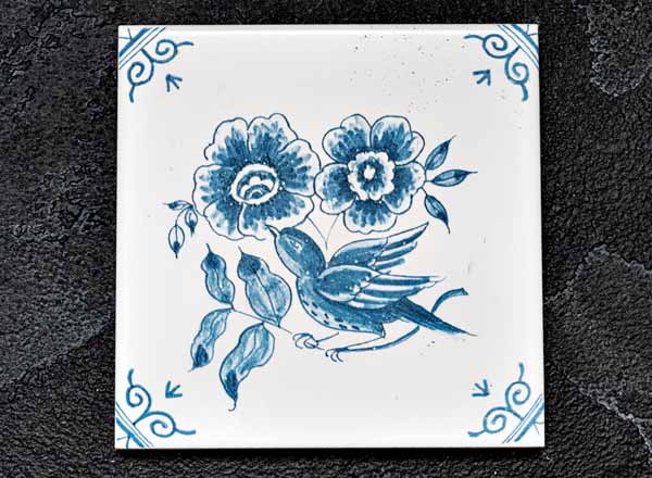 Tile Dutch. Flower with a bird 