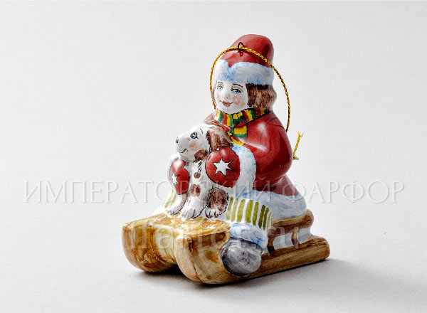 Christmas tree toy Boy on a sled with a dog